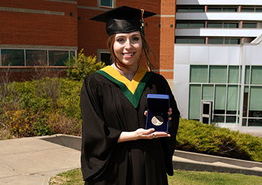 Goldsmith holding her Governor General's medal