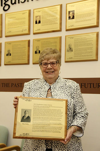 Mary Holtby with distinguished citizen plaque