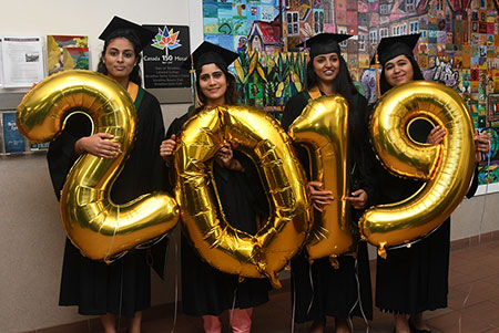 Lloyd grads with 2019 balloons