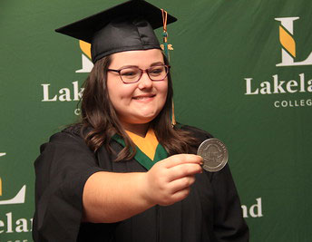 Sierra holding out her presiden't medal