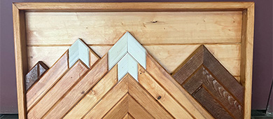 A group of wood pieces strategically placed to create a mountain scene.